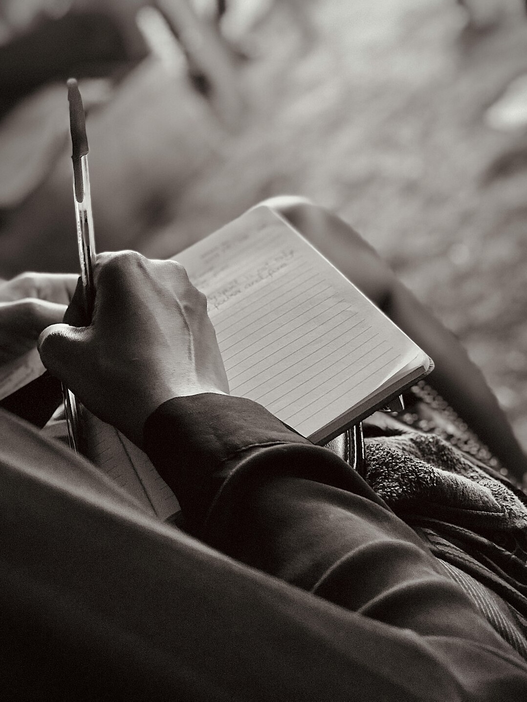 woman writing in notebook