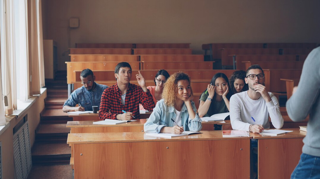 adult student taking notes