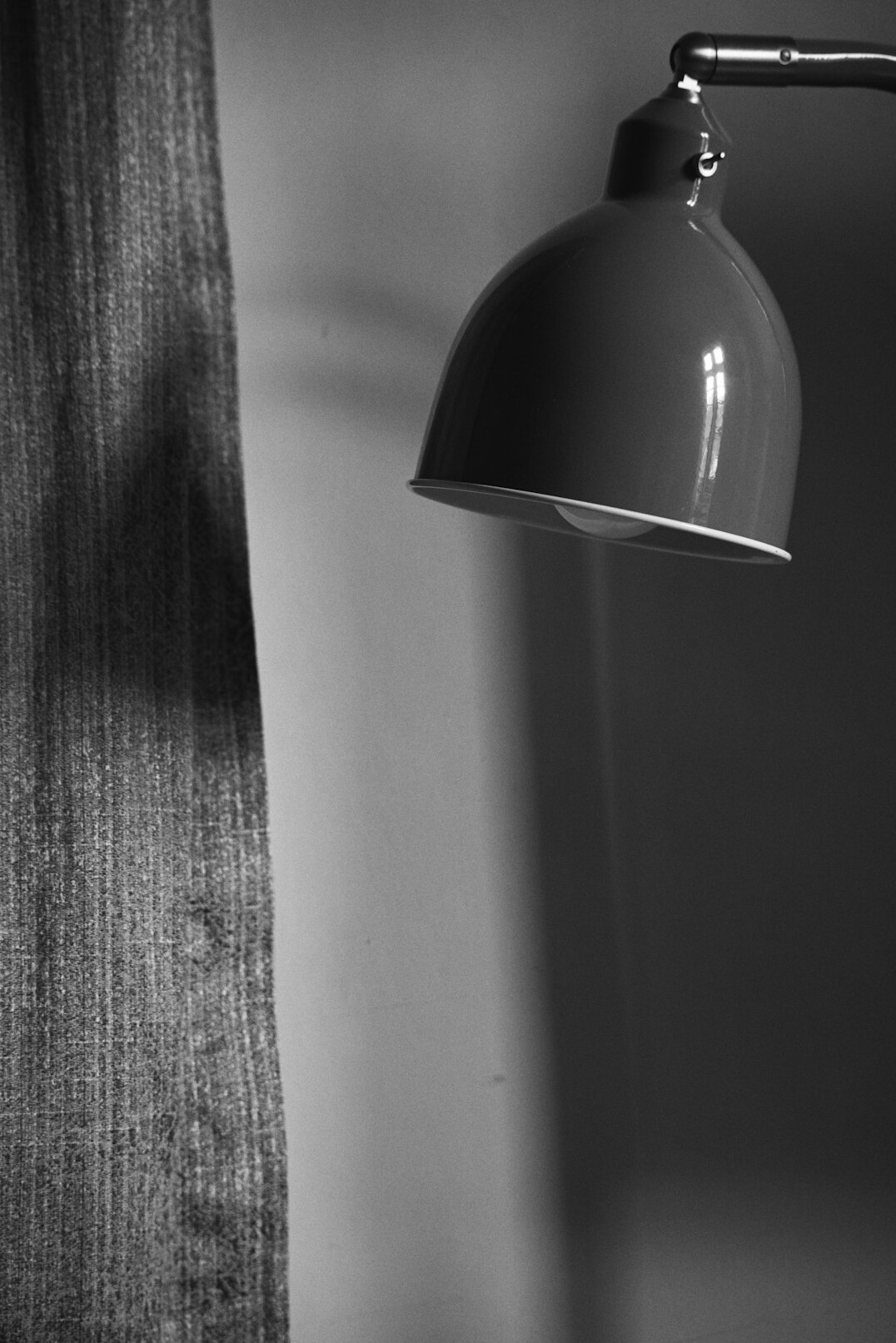 Notebook and pen on a desk with a lamp