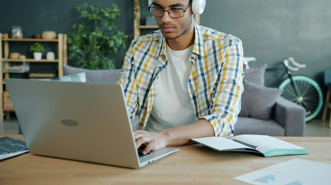 man studying online