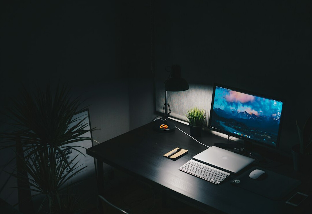 Laptop with code on screen on a desk