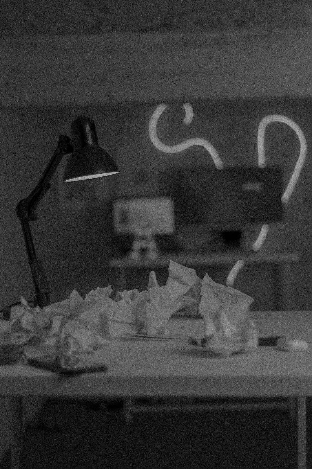 Desk with papers, charts and a laptop